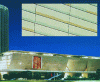 Figure 8 - Elements in polished white concrete inlaid with grey-blue or ochre natural aggregate concrete, randomly arranged in the lower section. Extension to the Palais des Congrès, Paris [Ch. de Portzamparc]. 