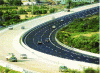 Figure 20 - View of a freeway with BAC/GB3 composite pavement (left side without surface course, right side with surface course)