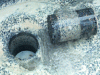 Figure 21 - Core sample illustrating the excellent bond between concrete and bitumen gravel