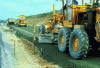 Figure 8 - Laying gravel treated with hydraulic road binder