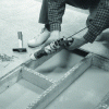 Figure 6 - Gluing floor panels with mastic adhesive cartridges