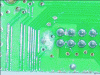 Figure 16 - Integrated circuit board with whitish corrosion product containing lead, tin and chlorides