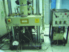 Figure 1 - View of a hot-pressing device in channel-die configuration (servo-hydraulic cylinder).