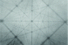 Figure 10 - Ion Blocking Pattern of tungsten,
produced with 200 keV protons. The spot in the center represents the
[100] direction. The photographic plate was positioned perpendicularly
to this axis ([26], the print of the pattern has been
provided personally by Anatoly F. Tulinov, Lomonosov Moscow State
University)