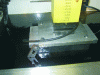 Figure 6 - The workpiece and electrode are immersed in the electrolyte. The top of the electrode can be seen protruding from the bath.