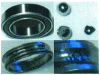 Figure 12 - Bearing before experimentation (top left) and after experimentation (with details of cage and balls)