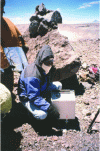 Figure 13 - Geophysicist taking a measurement with a Scintrex CG-3M gravimeter at the summit of the Lascar volcano in Chile, at an altitude of 5,600 m.