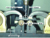 Figure 6 - Experimental set-up for punching tests with a drill of diameter d = 4.8 mm on a quasi-isotropic plate