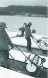 Figure 4 - Full-bond installation of thermoplastic olefin TPO waterproofing membranes (Firestone Ultraply brand). The special glue is applied quickly with these carts carrying buckets of glue (source: Firestone USA).