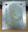 Figure 55 - Image of milk contamination on an unmodified 316L stainless steel heat exchanger plate after 8 h of milk pasteurization (after [40])