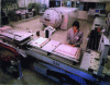 Figure 2 - General view of the room where packs are prepared for the autoclave press, in the background.
