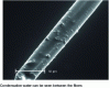 Figure 25 - Observation at 10 kV in an environmental chamber microscope of two bonded glass wool fibers at a partial pressure of 700 Pa (5 torr) (EDF document)