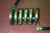 Figure 7 - Steel part placed in a magnetizing coil
consisting of six turns (photo credit: SREM Technologies).