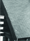 Figure 12 - Damage to the side edge of an asphalt shingle roof (elements torn off) (credit J.P.)